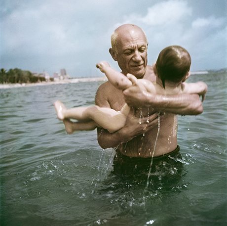 Pablo Picasso playing in the water with his son Claude, Vallauris, France, 1948. Photograph: Robert Capa/International Center of Photography/Magnum Photos